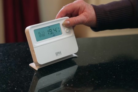 Person turning up the heating