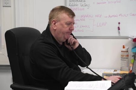 Cosy Homes staff member talking to a Lancashire resident on the phone