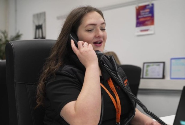 A Cosy Homes staff member on a phone call with a Lancashire resident