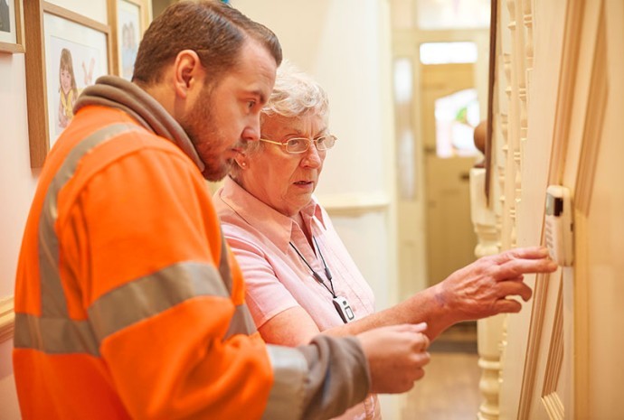 Heating Engineer With Old Lady