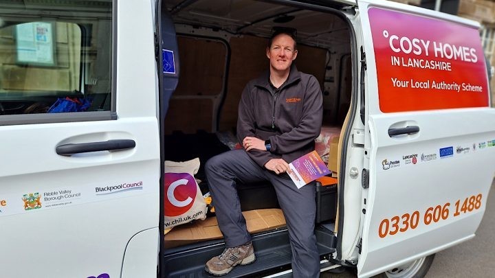 The Handy Person stood with the Little Van of Warm from Cosy Homes