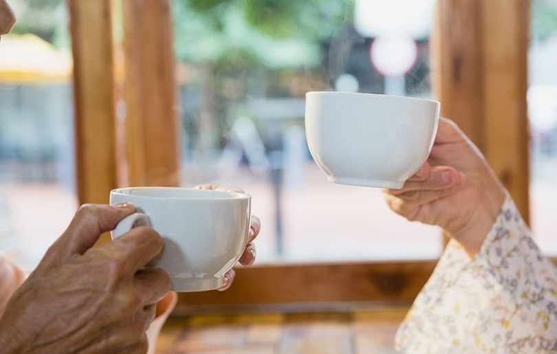 Friends Talking Over Coffee