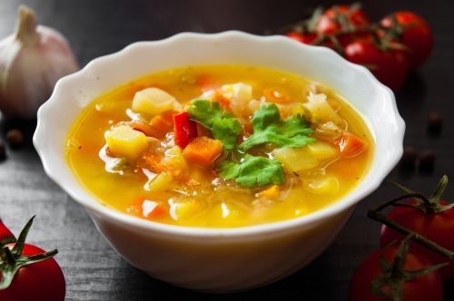 Bowl of warm chunky vegetable soup